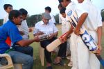 image of Sachin's ex coach Ramakand Achrekar signing bats, Mumbai