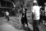 image of Ronaldo fan at night box cricket match behind Crawford Market, Market
