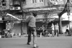 image of Hoiking a boundary in sunday street cricket at Fort, Mumbai